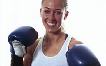 Laura wearing boxing gloves.