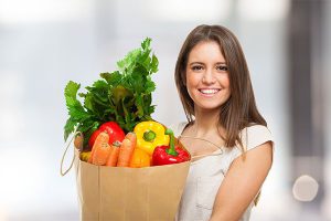 Photo of woman holding groceries